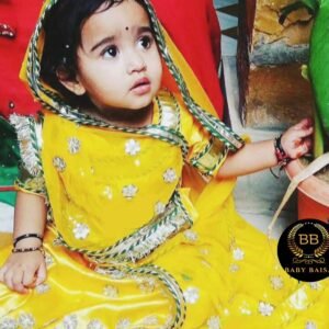 The poshak features a flowing lehenga, a stylish kurti-kanchali, and a graceful odhani, all crafted in a vibrant yellow color. For Girls