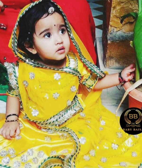 Rajputi Poshak for 3 Years Old Baby Girl (3 to 10) in Yellow Color The poshak features a flowing lehenga, a stylish kurti-kanchali, and a graceful odhani, all crafted in a vibrant yellow color. For Girls